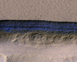 An enhanced-color view of underground ice exposed at the slope. 